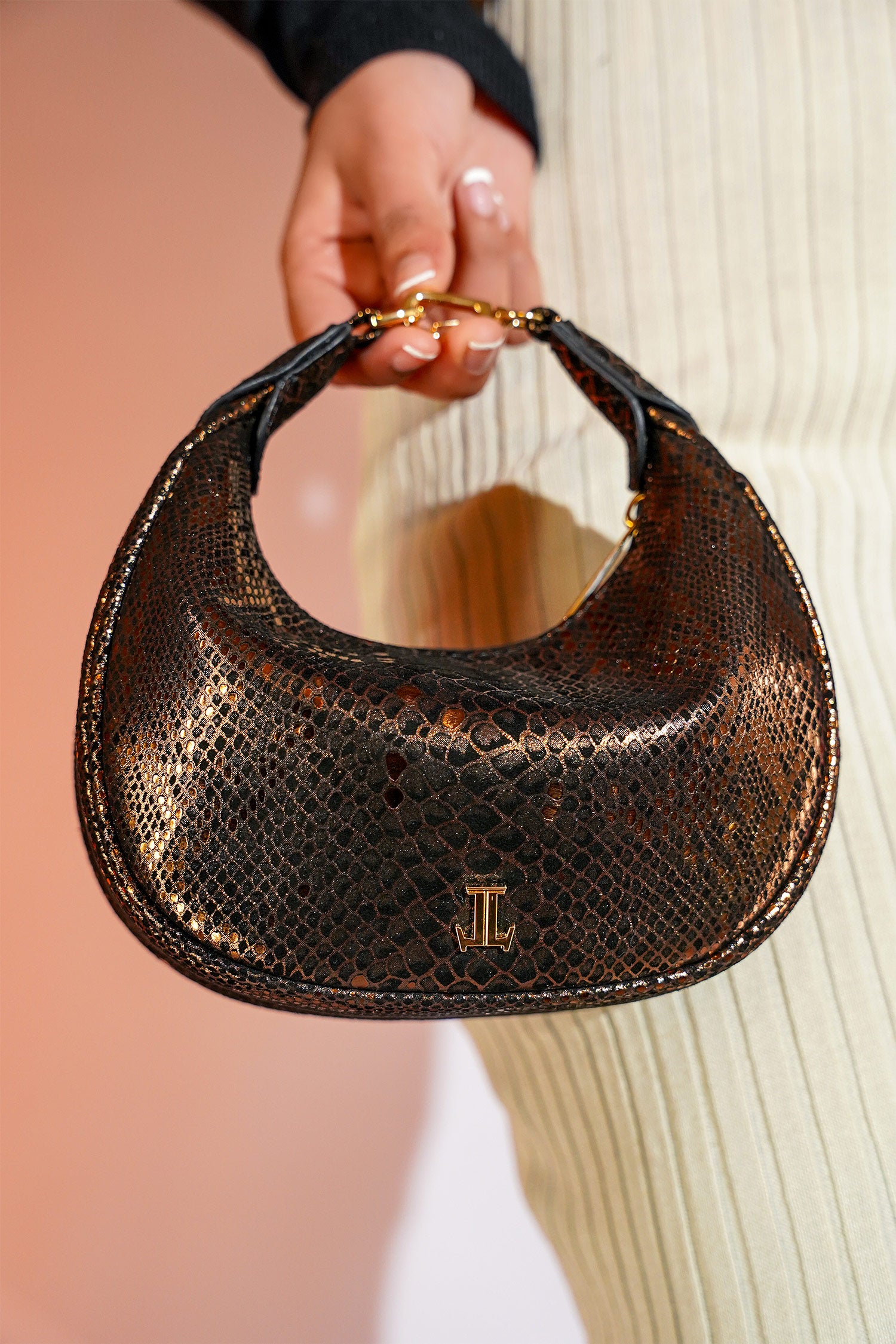 Women's leather mini hobo bag in copper black colour with 3d reptile texture and unique clip-on handle by JULKE