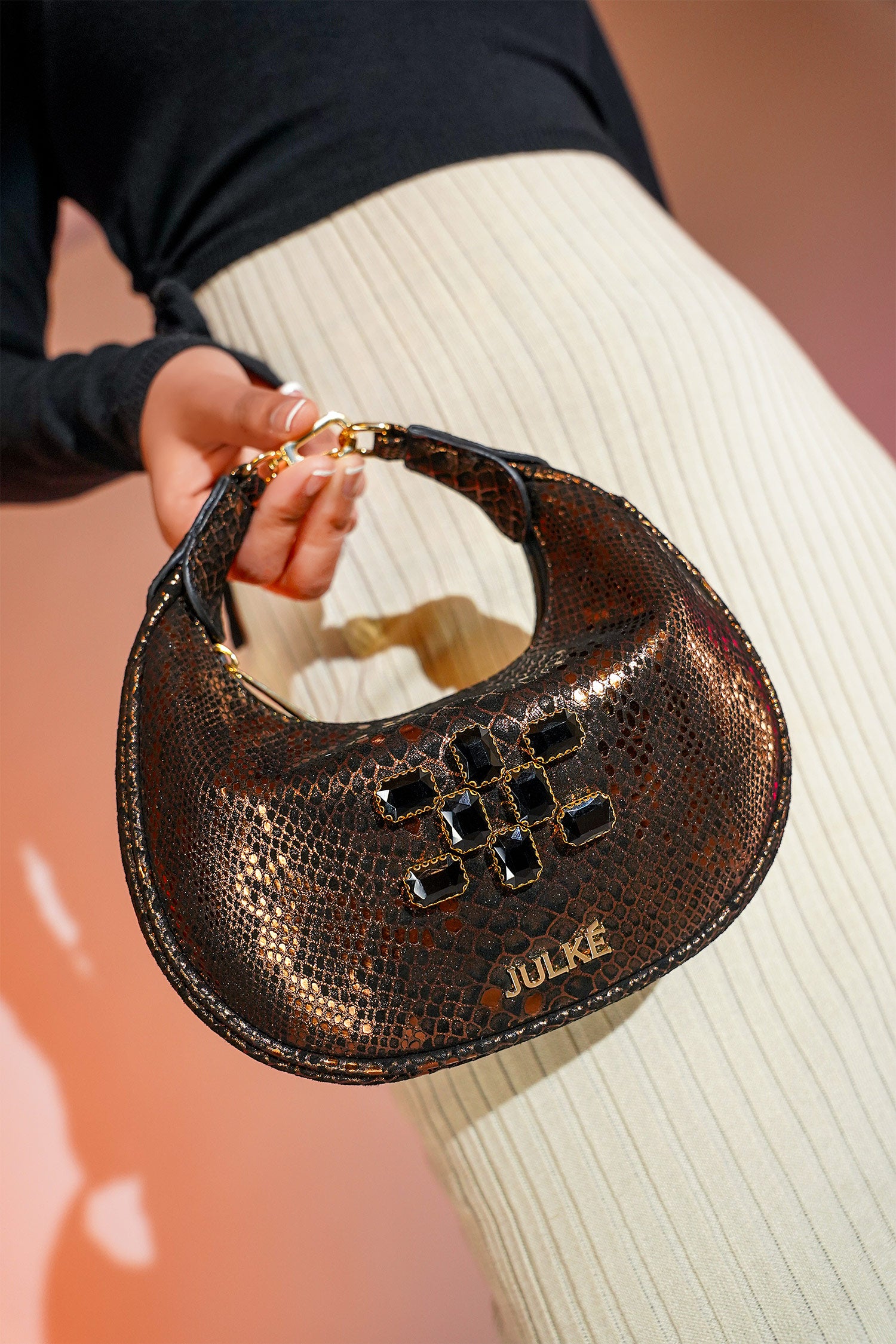 Women's leather mini hobo bag in copper black colour with 3d reptile texture and unique clip-on handle by JULKE
