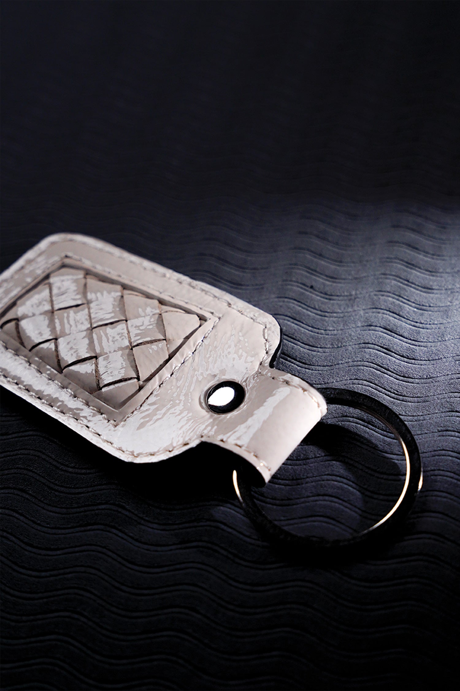 Leather key chain in white colour with weaving and metal ring by JULKE