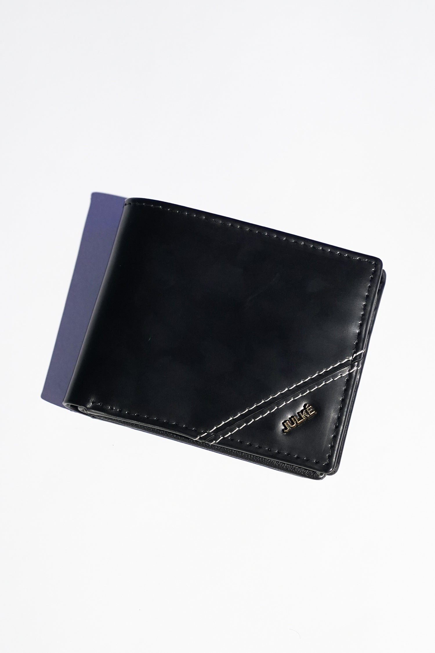 Mens leather bifold wallet in black colour with white contrast stich and metallic hardware by JULKE