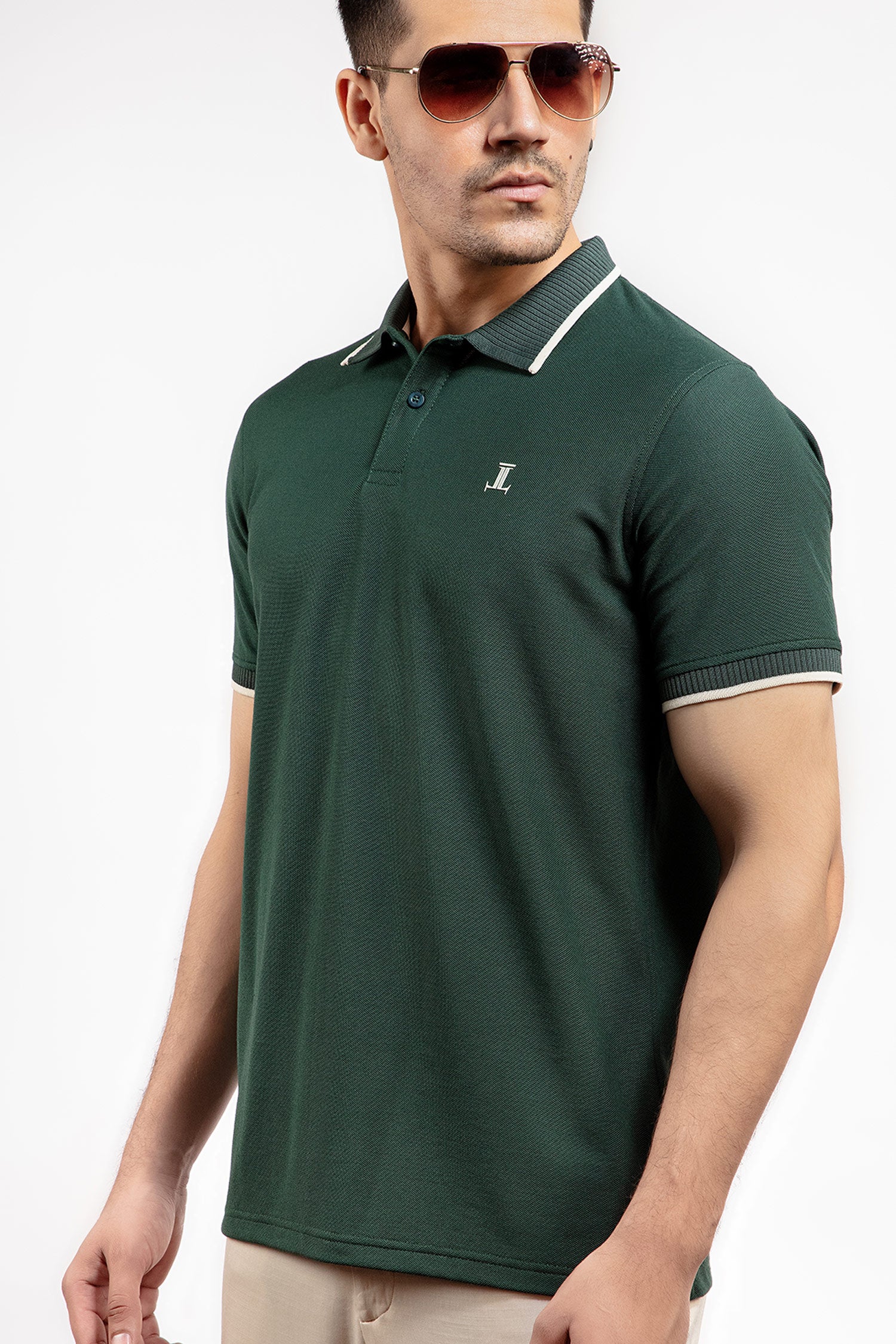 Mens summer polo shirt in dark green colour with matching white outline tipped collar and half sleeves by JULKE.