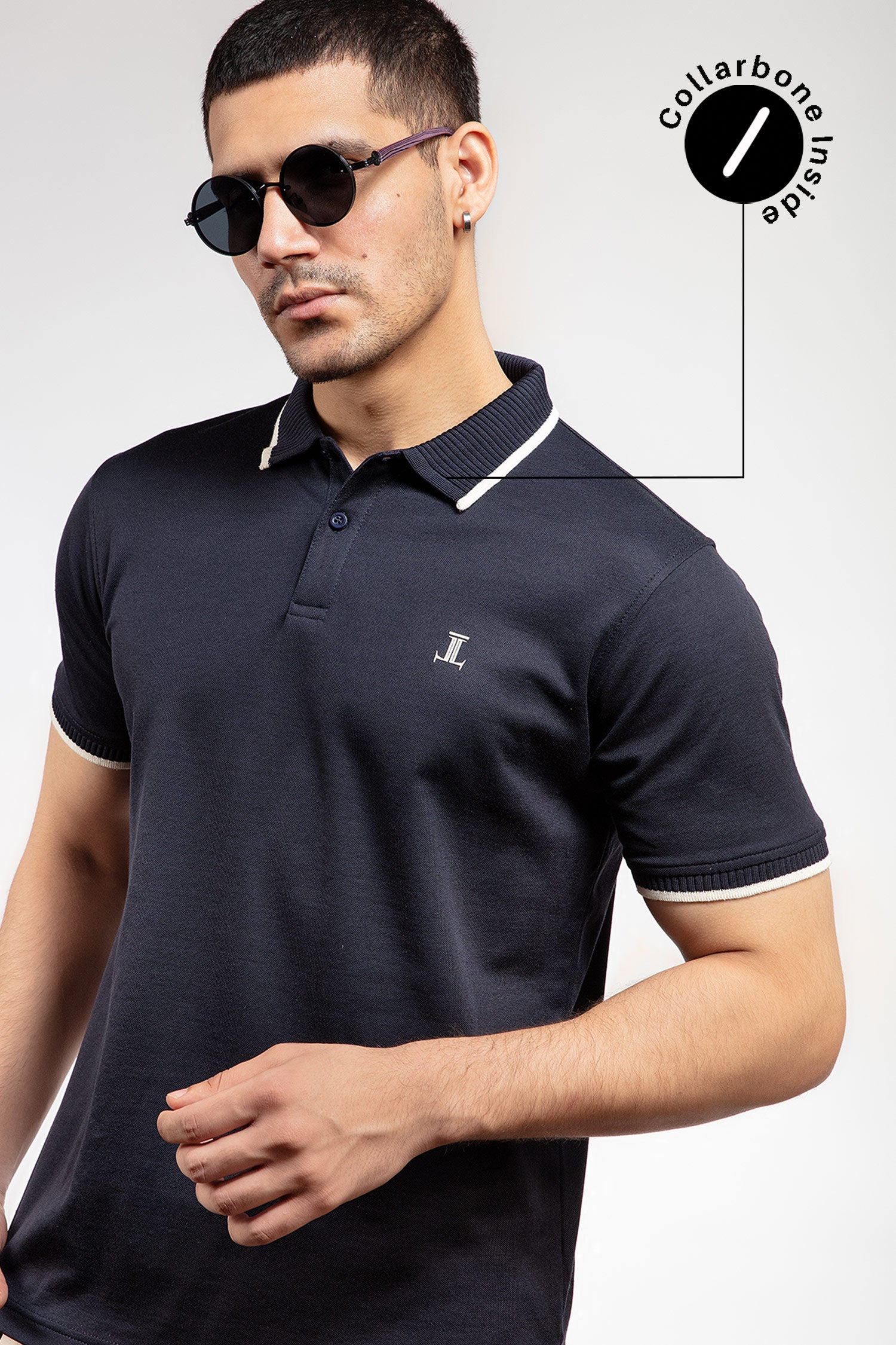 Mens summer polo shirt in navy blue colour with matching white outline tipped collar and half sleeves by JULKE.