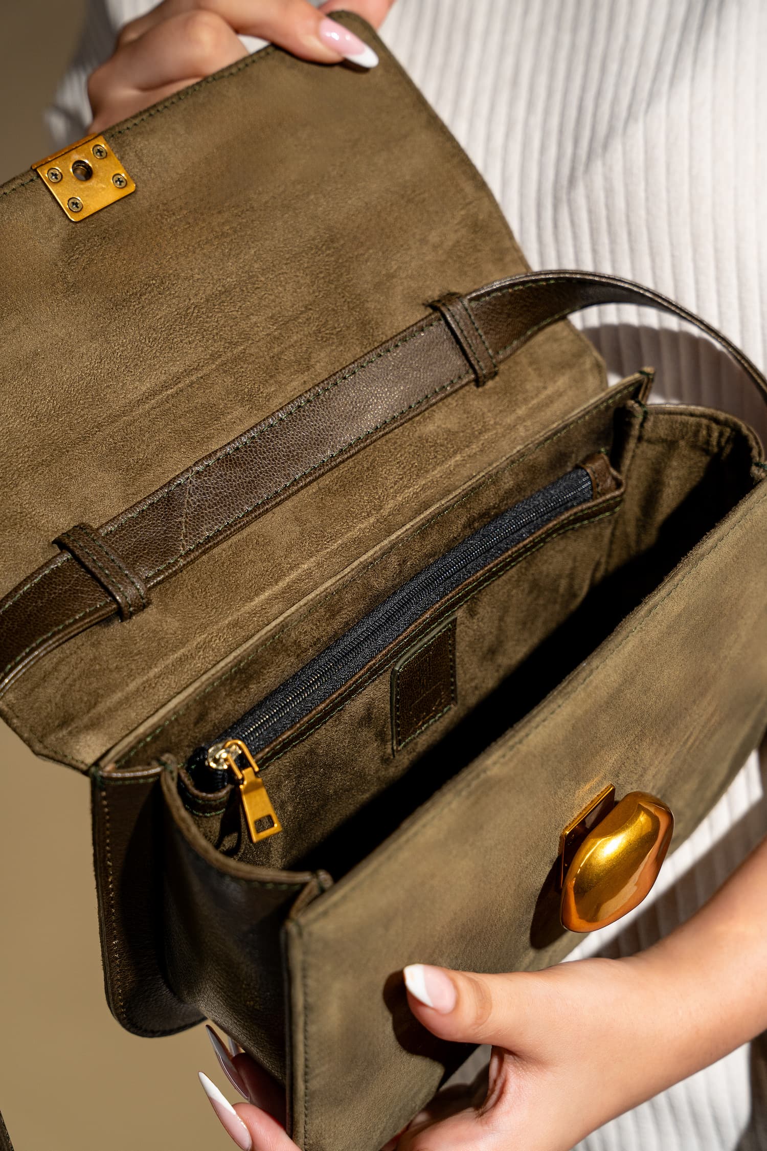 Womens suede & leather crossbody shoulder bag in olive green colour with adjustabl shoulder strap and unqiue metallic gold push lock by JULKE