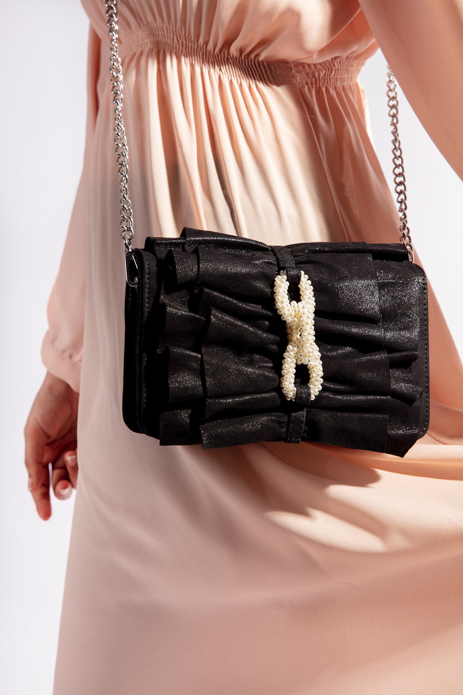 Womens leather shoulder bag in black colour with bows and pearl chain by JULKE