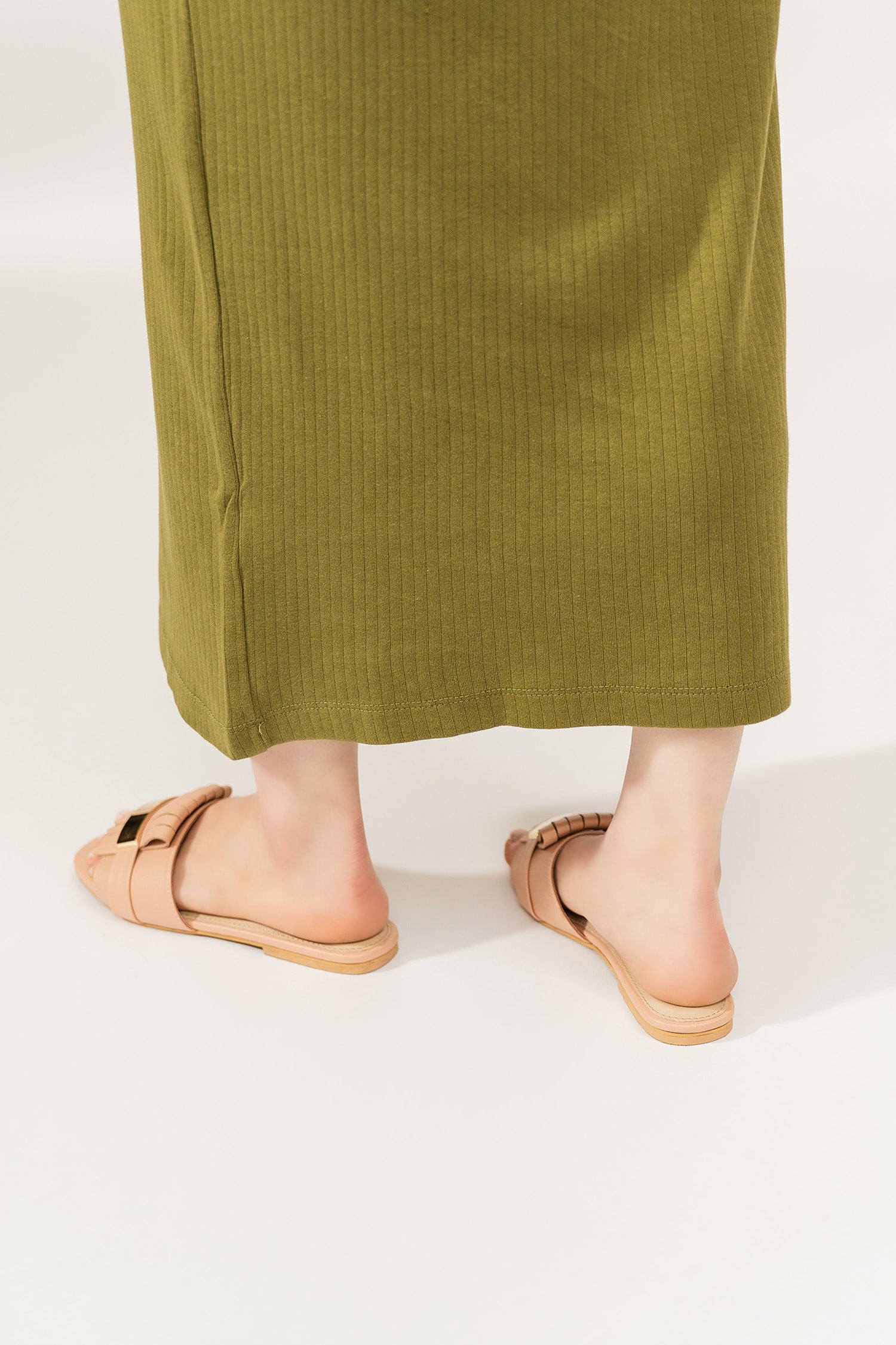 Womens leather flat shoes in light pink colour with matching fringe and metallic gold leather strap by JULKE.