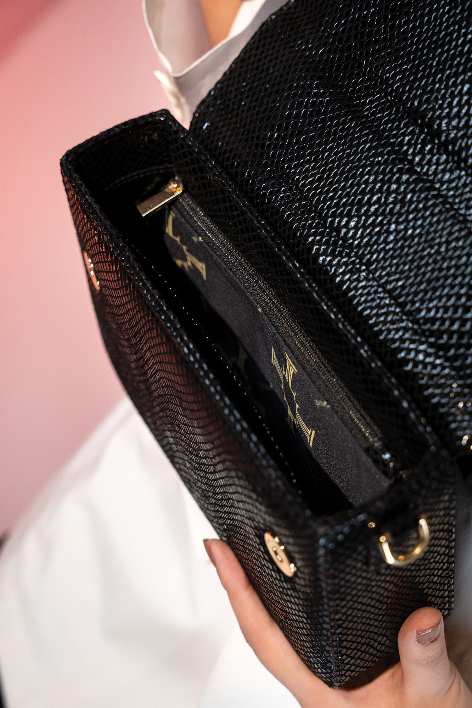 Women's leather top handle shoulder bag in black reptile texture with metal wood and metallic gold chain strap by JULKE