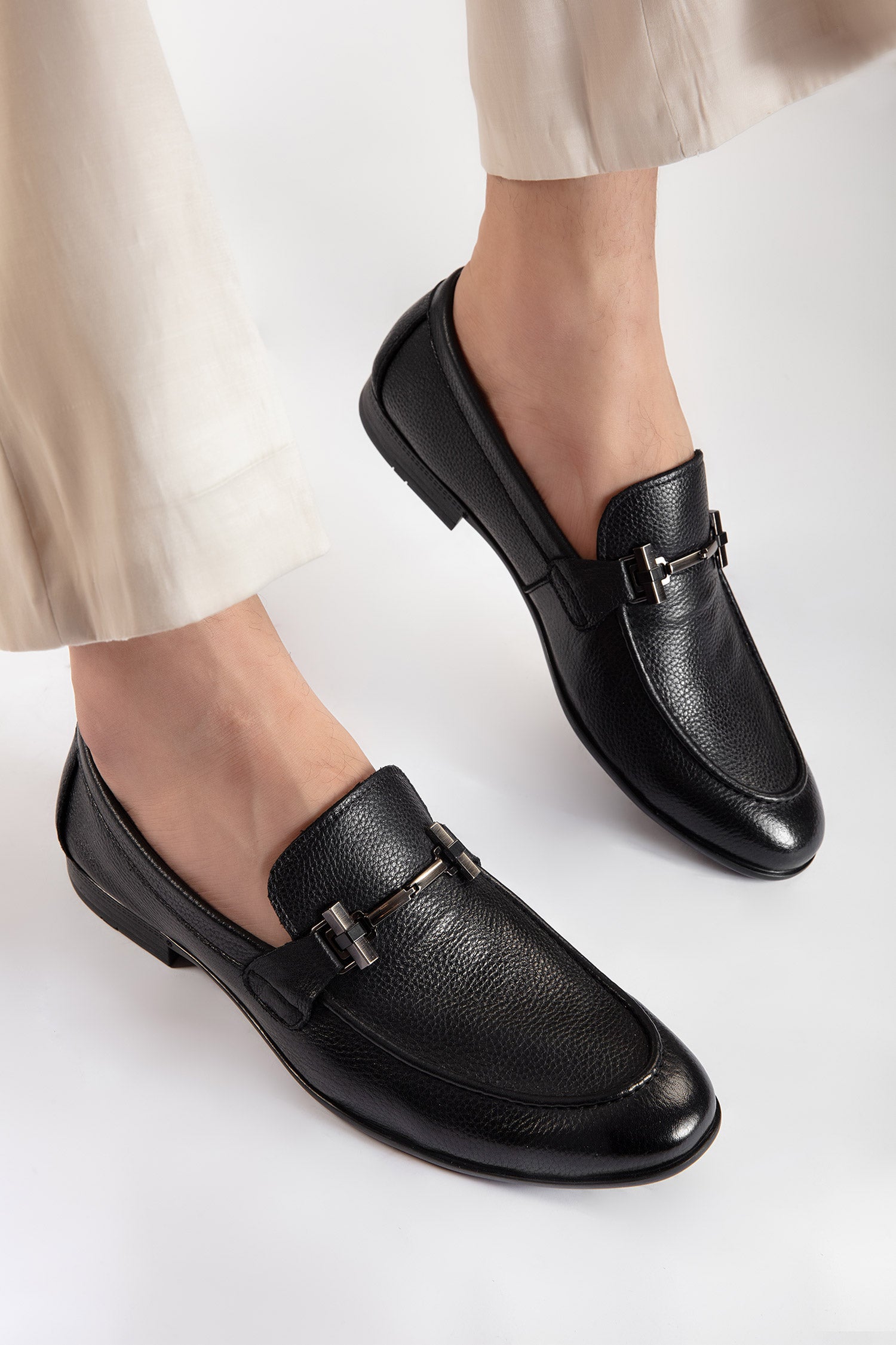 Mens leather round toe slip on shoes in black colour with leather and rubber sole and metal T-bar buckle by JULKE