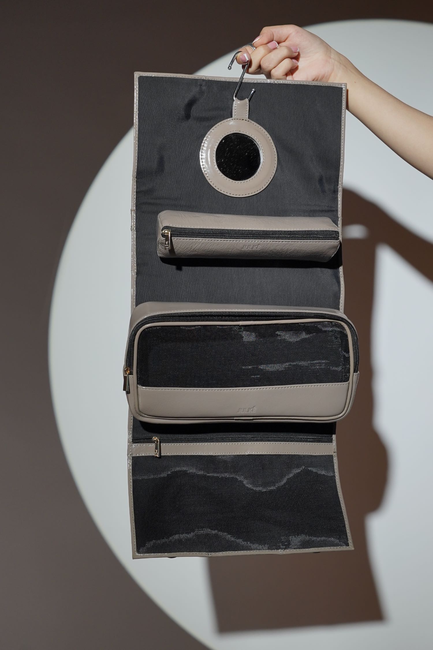 Women's leather makeup bag in grey colour with built in pockets and pouches by JULKE