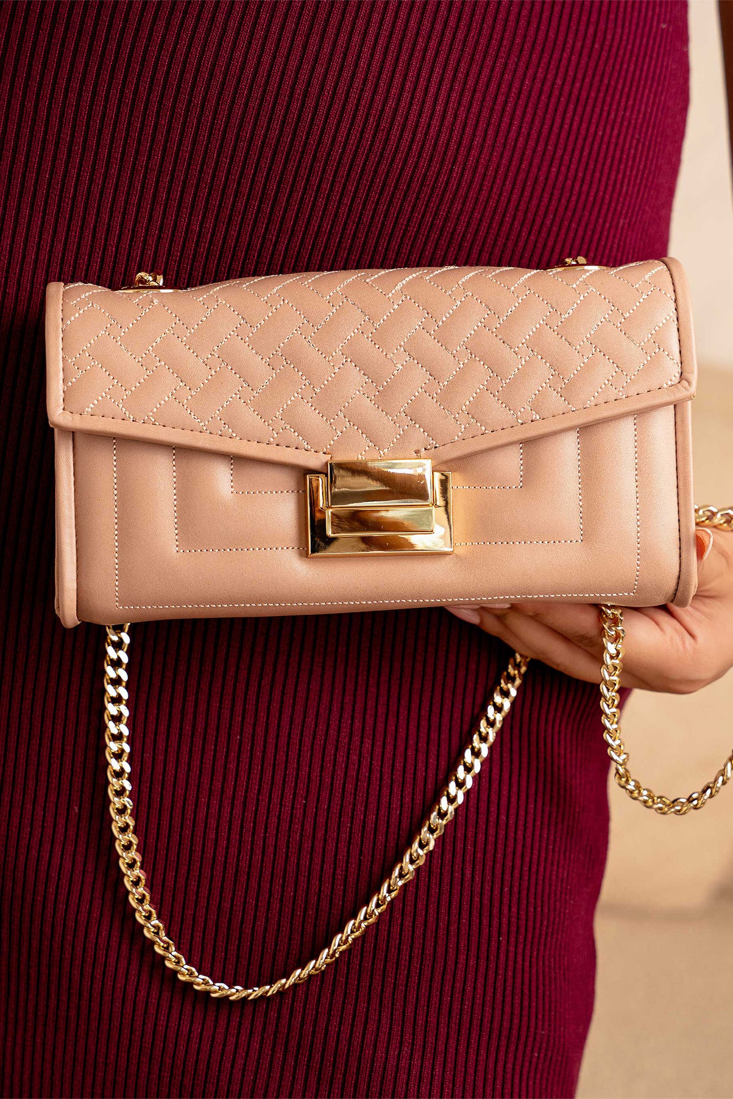 Womens leather shoulder clutch bag in tea pink colour with weaving quilted front flap and metallic gold hardware by JULKE.