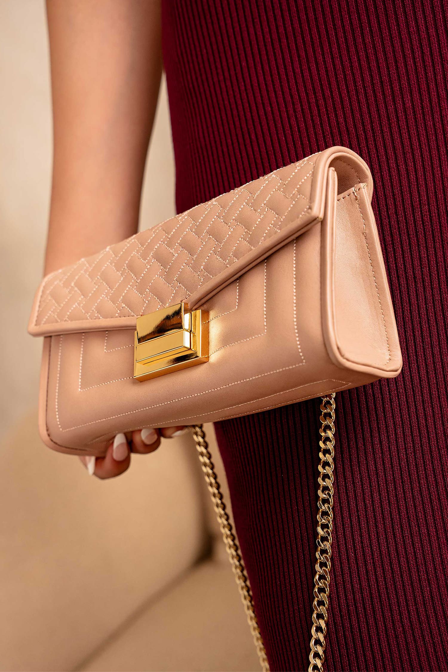 Womens leeather shoulder clutch bag in tea pink colour with weaving quilted front flap and metallic gold hardware by JULKE.