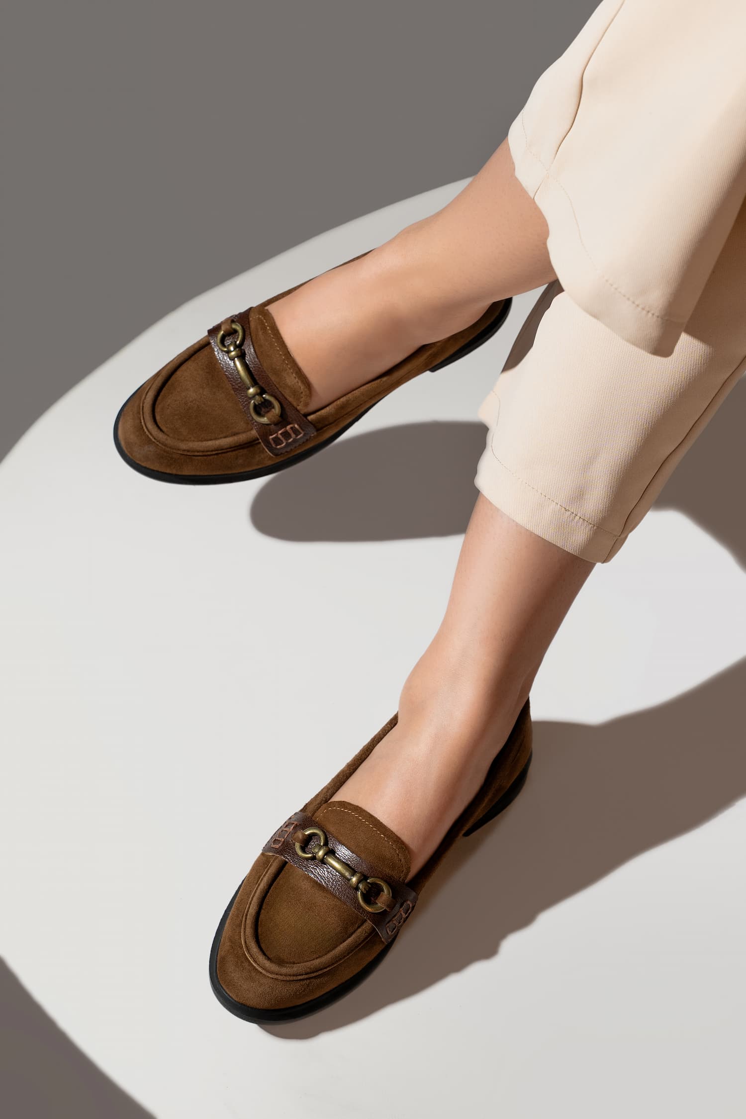 Womens suede leather loafers in brown colour with block heel and metallic gold buckle by JULKE.