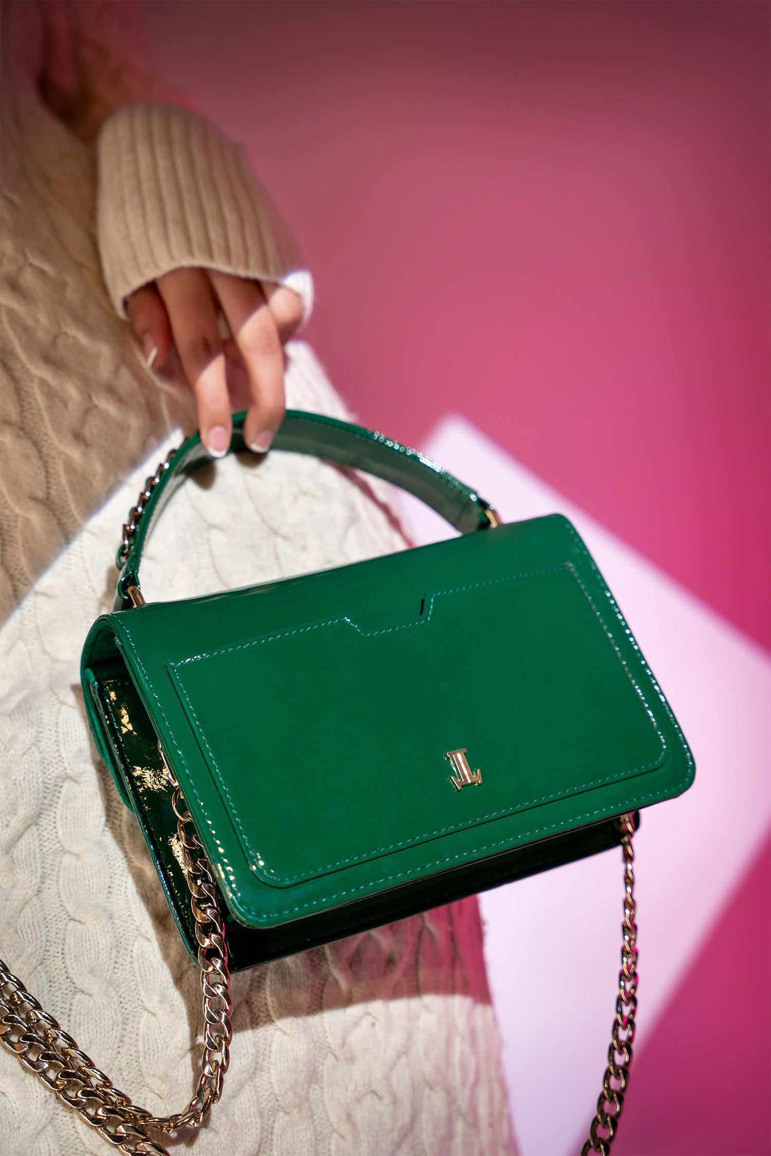 Women's leather top handle shoulder bag in green coloured patent and suede with golden chain and buckle brooch by JULKE