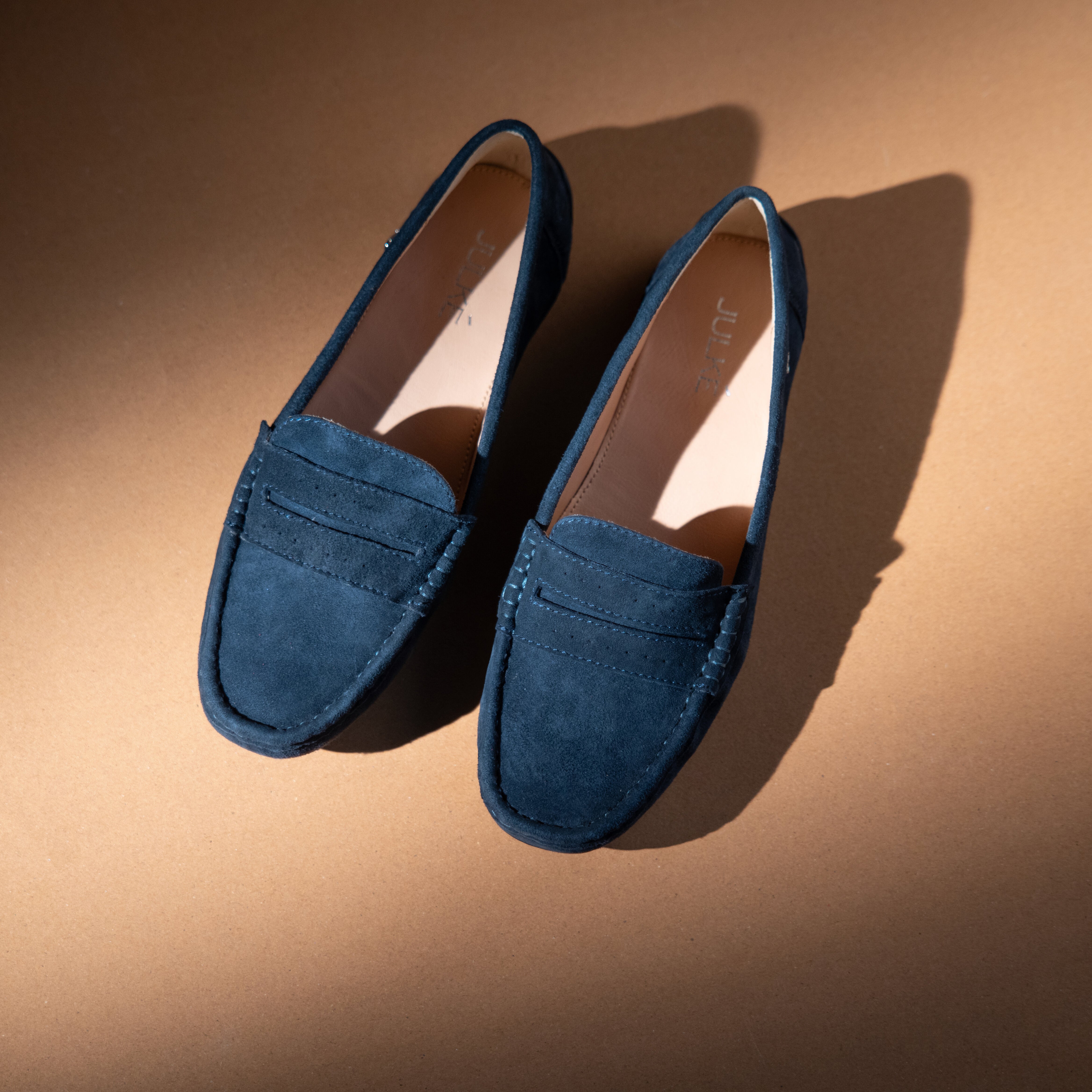 Women's winter suede leather moccasins in royal blue colour with metal logo trim and moc toe by JULKE