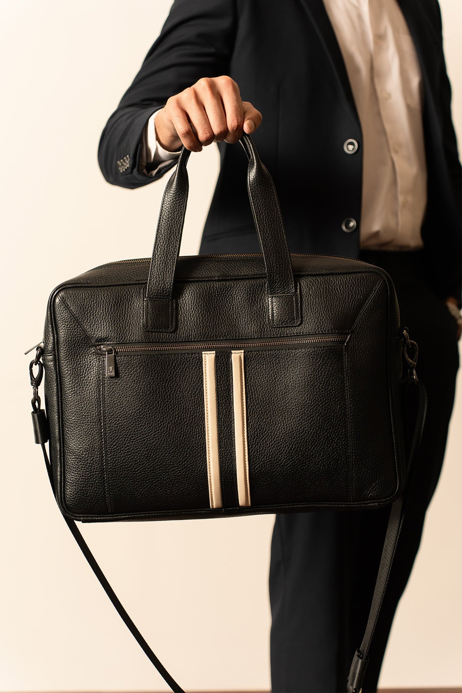 Mens soft leather laptop bag in black colour with off white leather stripe in front and metallic grey hardware by JULKE.