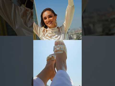 Womens flat slides in gold and white colours with glossy reptile texture and asymmetric rhinestone brooch by JULKE.