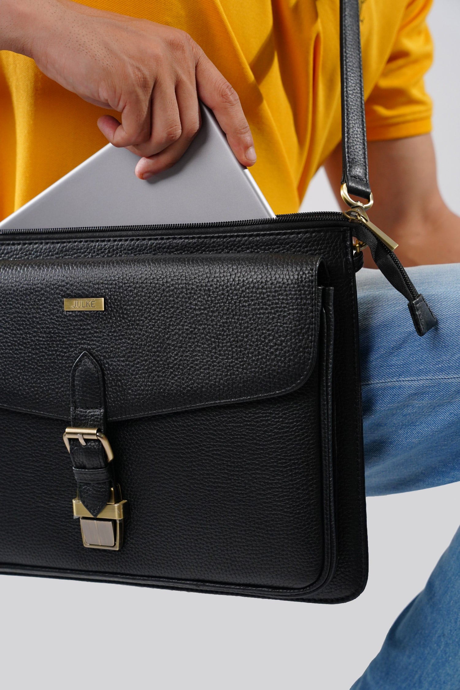 Leather laptop sleeve in black colour with shoulder strap by JULKE