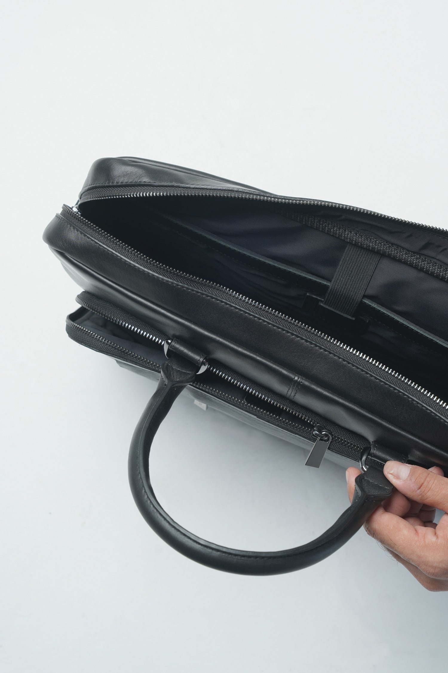 Mens leather laptop bag in black colour with top handle and extra pockets by JULKE