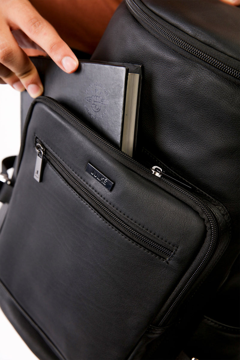 Mens original leather backpack in black colour with extra pockets for travel and hiking by JULKE