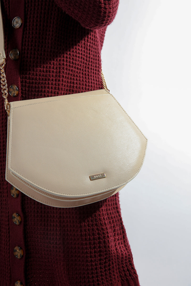 Womens leather shoulder bag in beige colour in accordion shape with quilting by JULKE