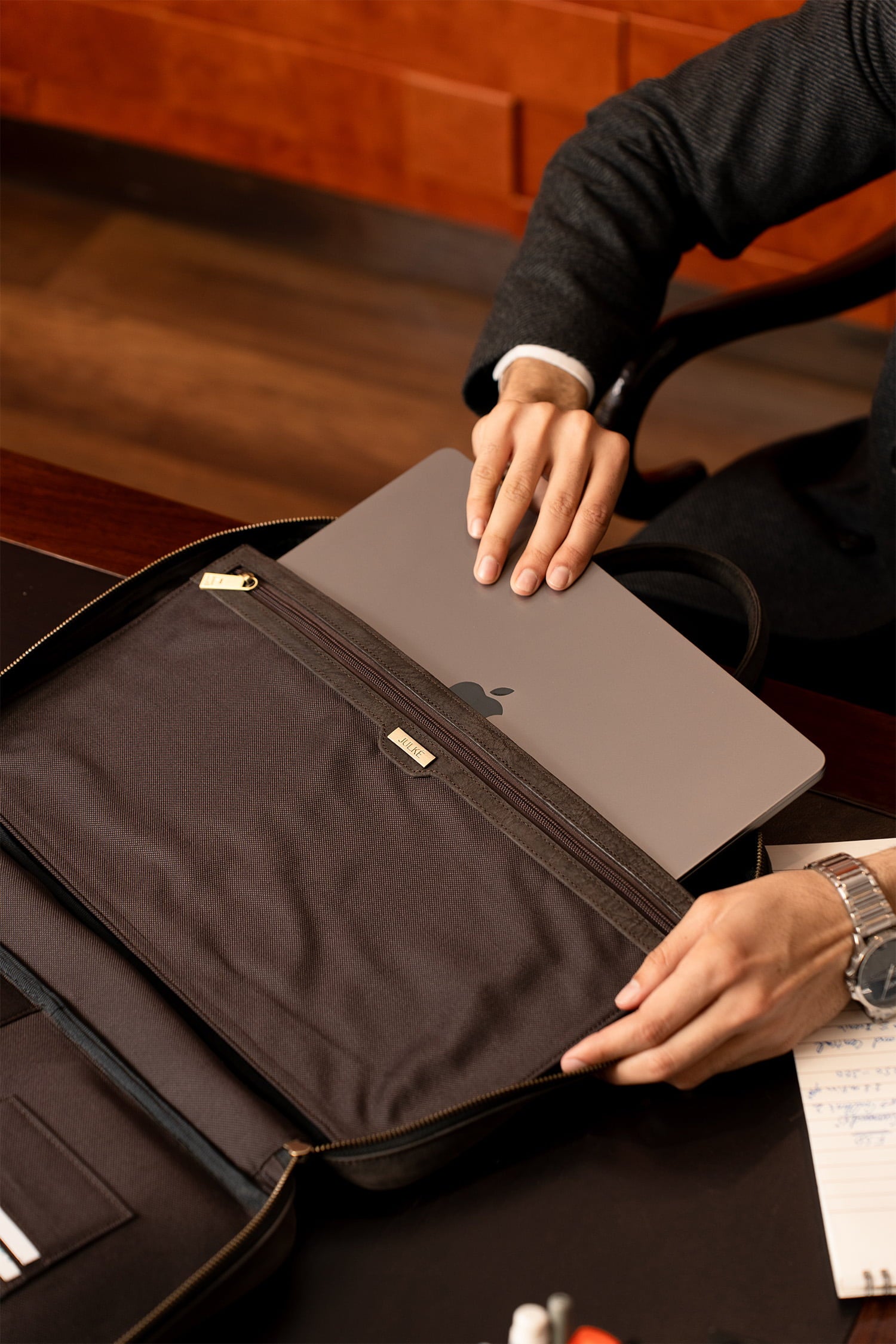 Mens nubuck leather laptop bag in dark brown colour with frotn contrast stitch and detachable shoulder strap by JULKE. 