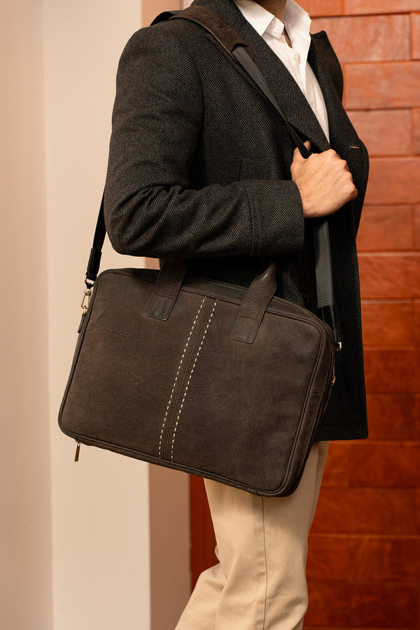Mens nubuck leather laptop bag in dark brown colour with frotn contrast stitch and detachable shoulder strap by JULKE. 