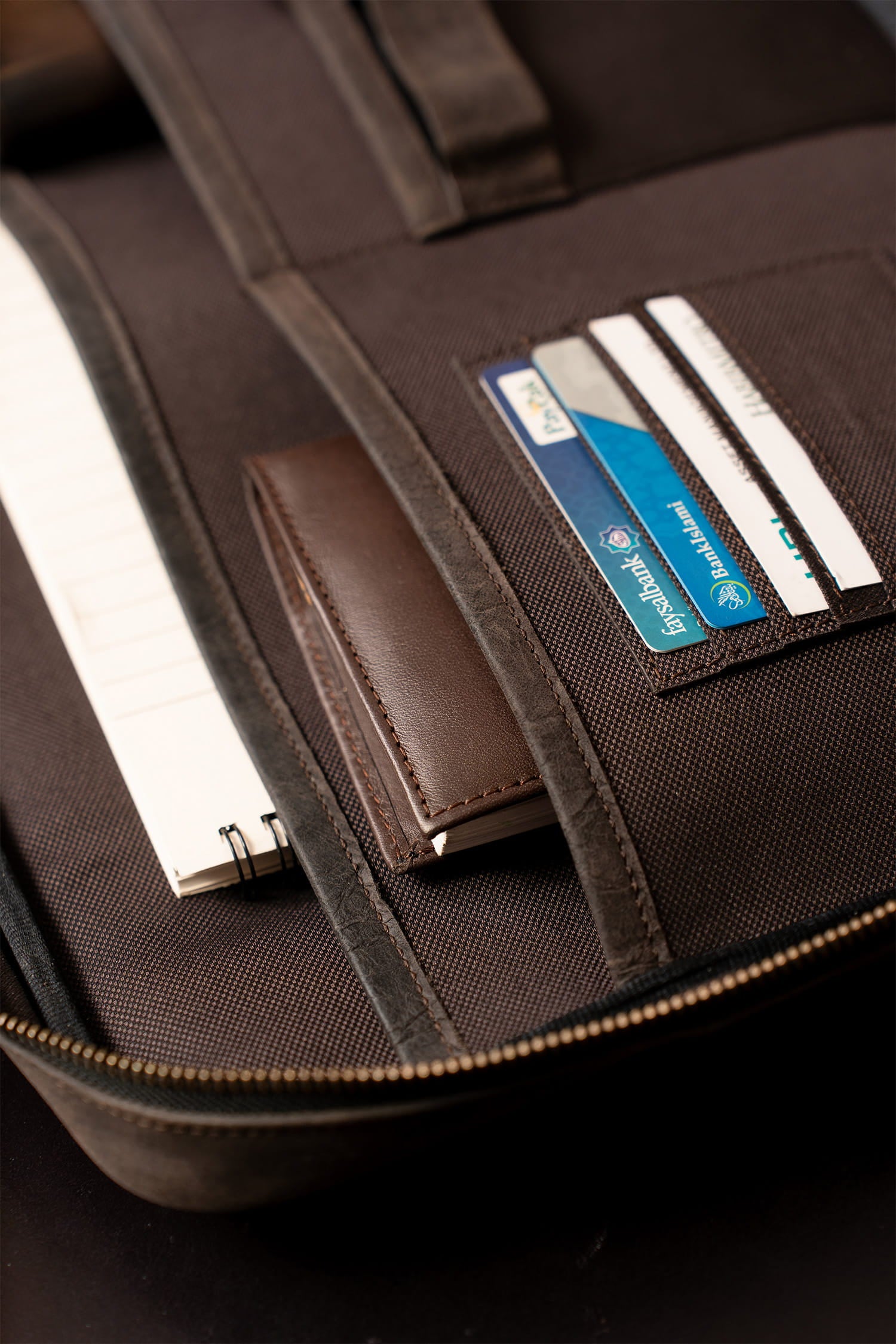 Mens nubuck leather laptop bag in dark brown colour with frotn contrast stitch and detachable shoulder strap by JULKE. 