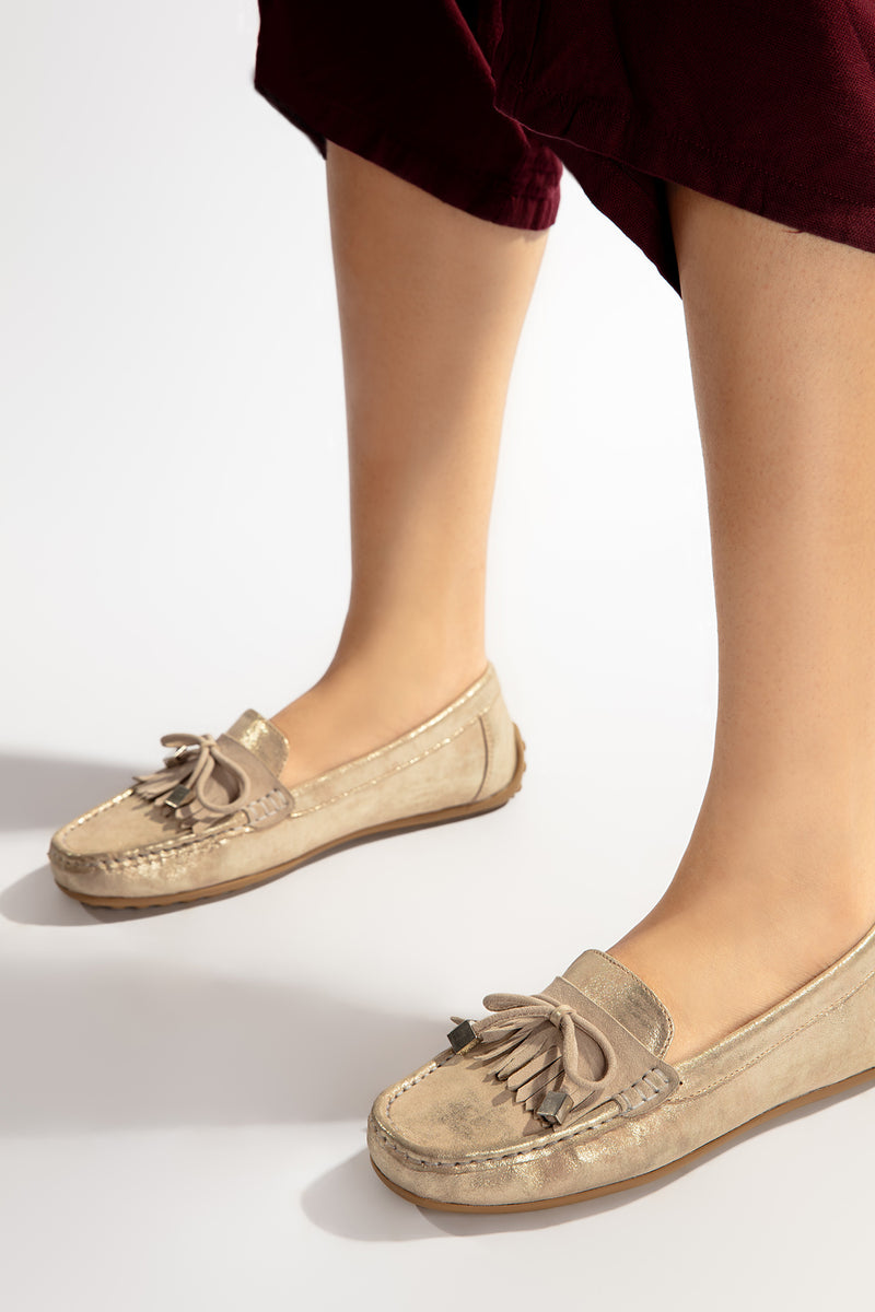 Women leather moccasins in beige colour with  glitter bow and  fringe by  JULKE