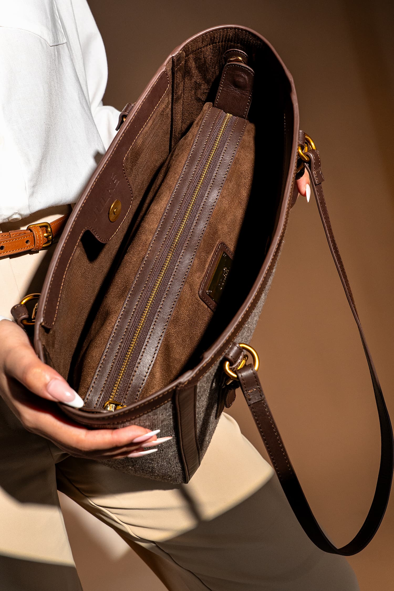 Women's leather & tweed shoulder tote bag in brown colour with removable inner suede pouch and metallic gold hardware by JULKE. 
