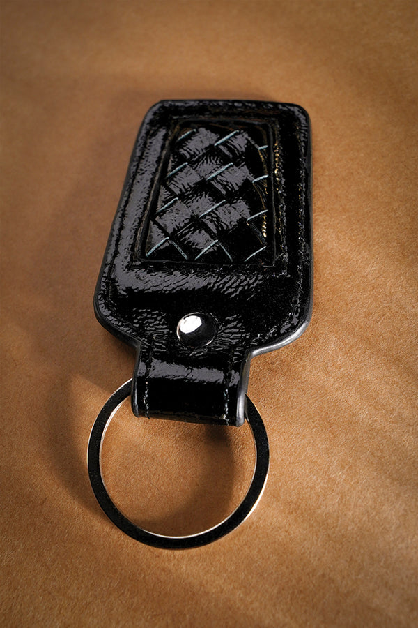 Leather key chain in black colour with weaving and metal ring by JULKE