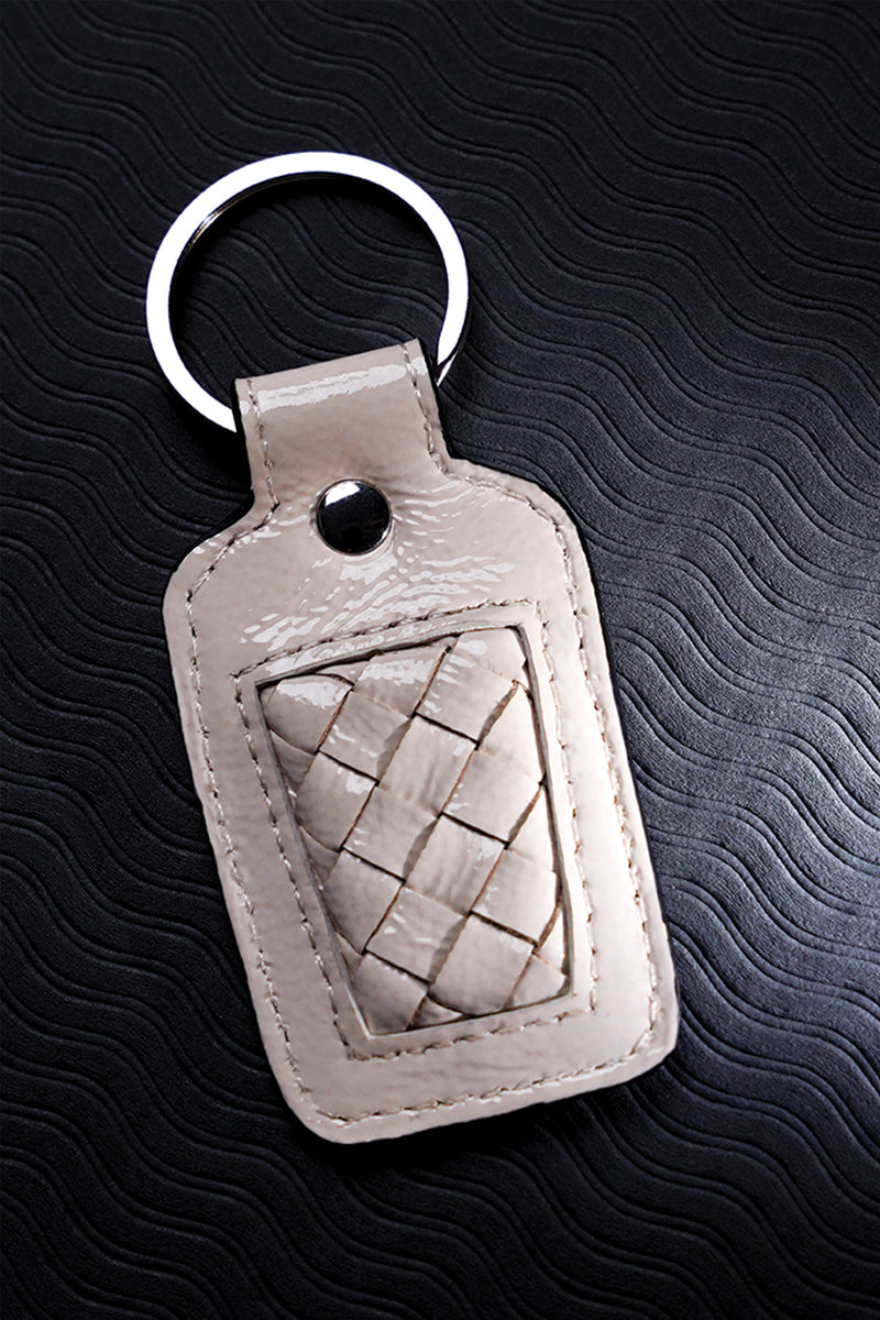 Leather key chain in white colour with weaving and metal ring by JULKE