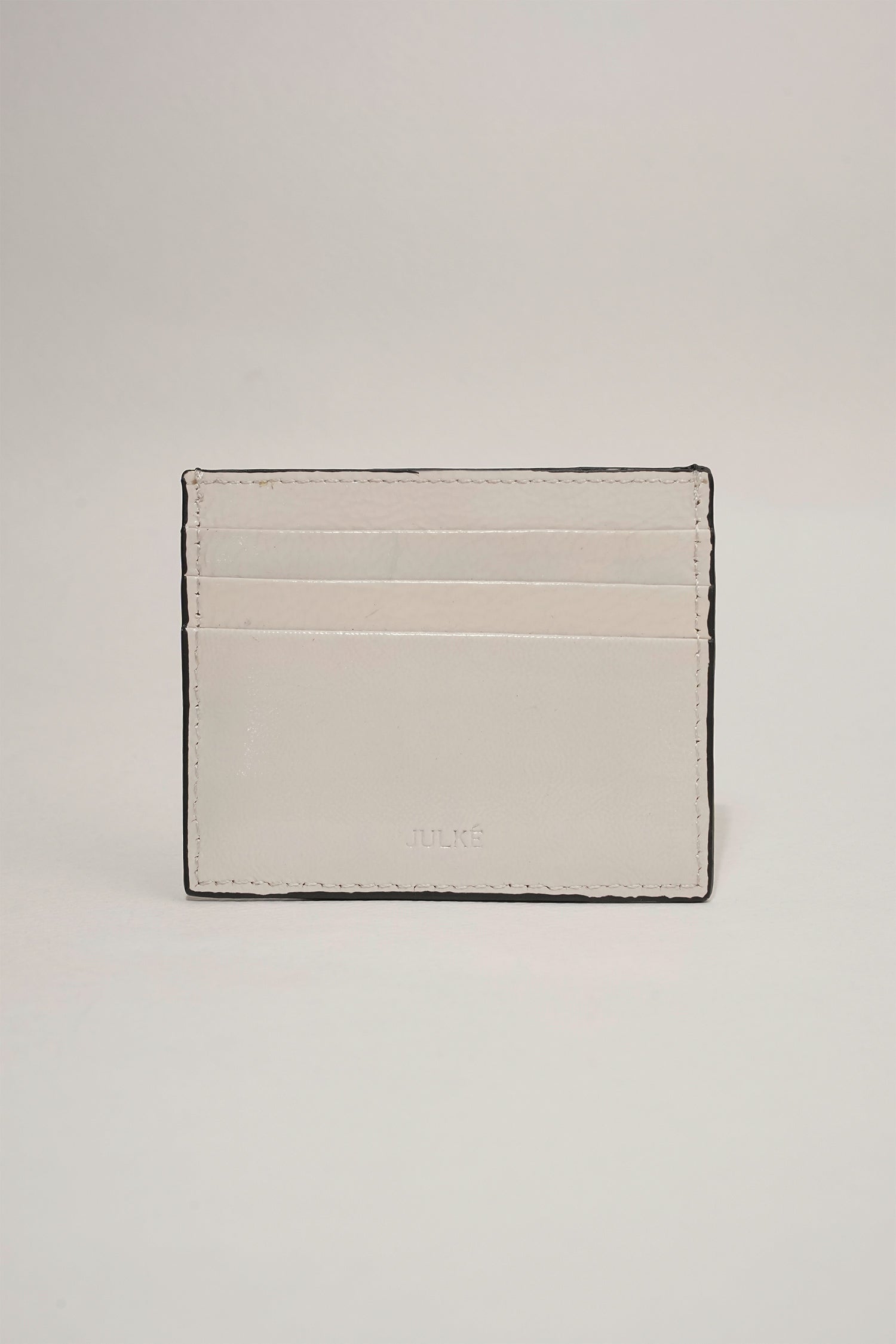 Unisex leather card holder in white colour with woven patch and hidden pocket by JULKE