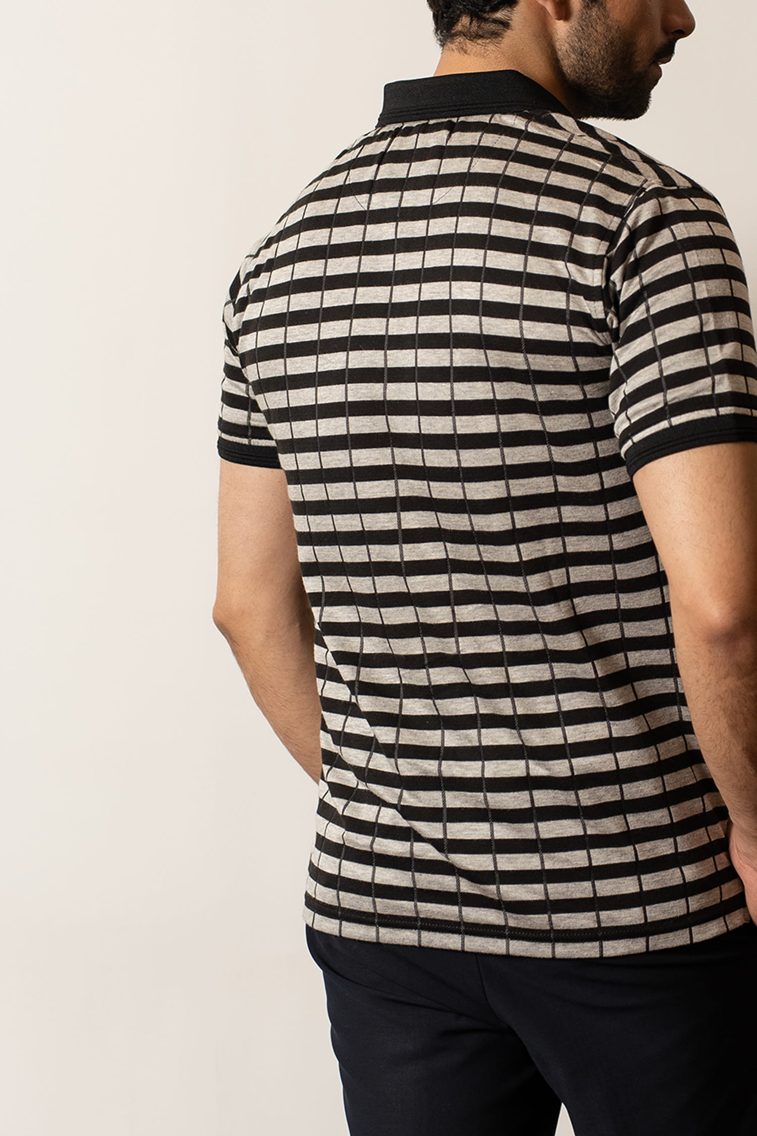 Mens half sleeve polo shirt in black and beige stripes with black collar and sleeve cuffs by JULKE. 
