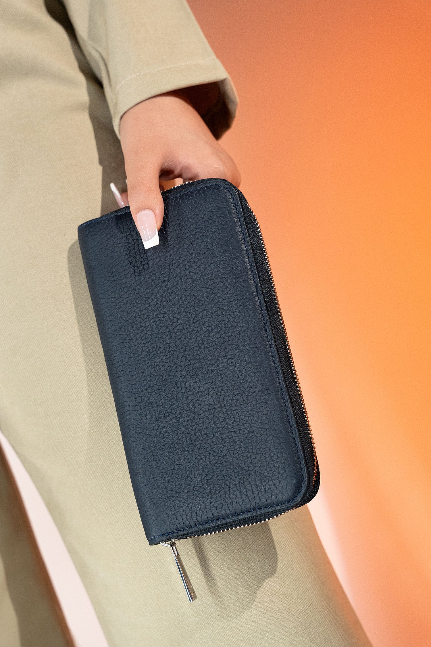 Women's leather long wallet in navy blue colour with zipper closure contrast stitch and metal brand logo by JULKE. 