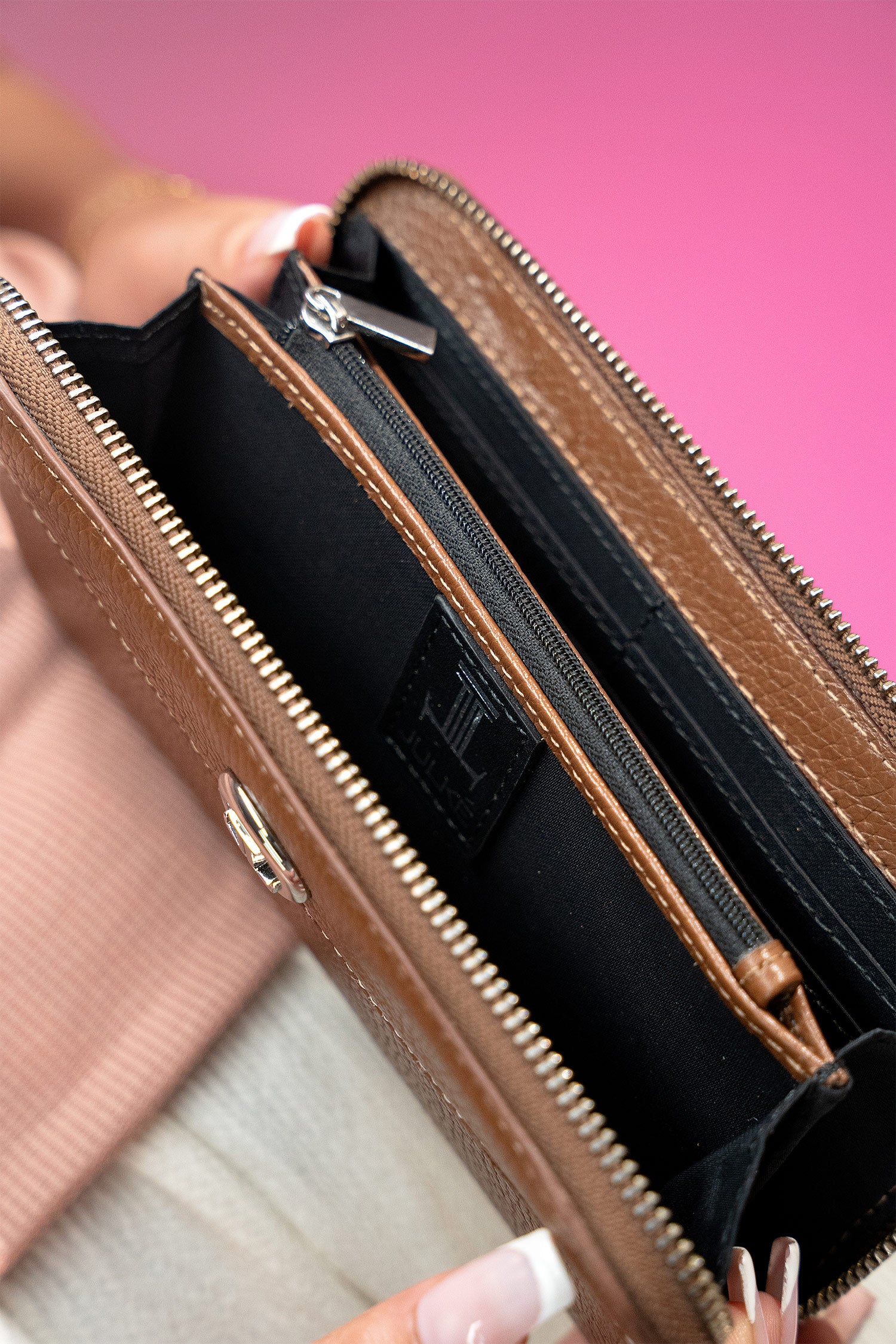 Women's leather long wallet in brown colour with zipper closure contrast stitch and metal brand logo by JULKE. 