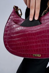 Womens leather shoulder baguette bag with croco texture and gold chain in maroon colour by JULKE