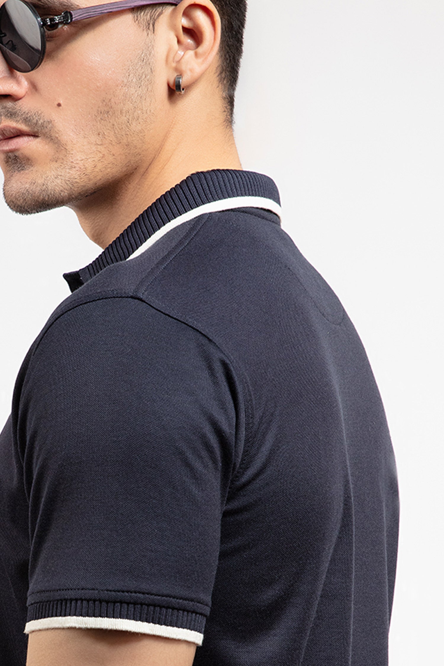 Mens summer polo shirt in navy blue colour with matching white outline tipped collar and half sleeves by JULKE.