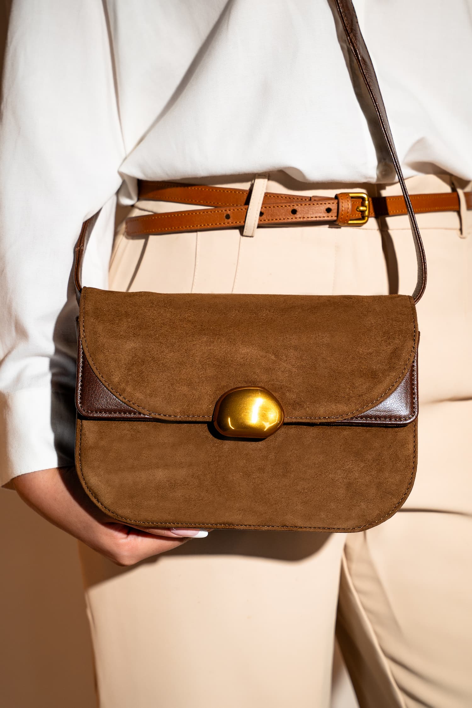 Womens suede & leather crossbody shoulder bag in brown colour with adjustabl shoulder strap and unqiue metallic gold push lock by JULKE 
