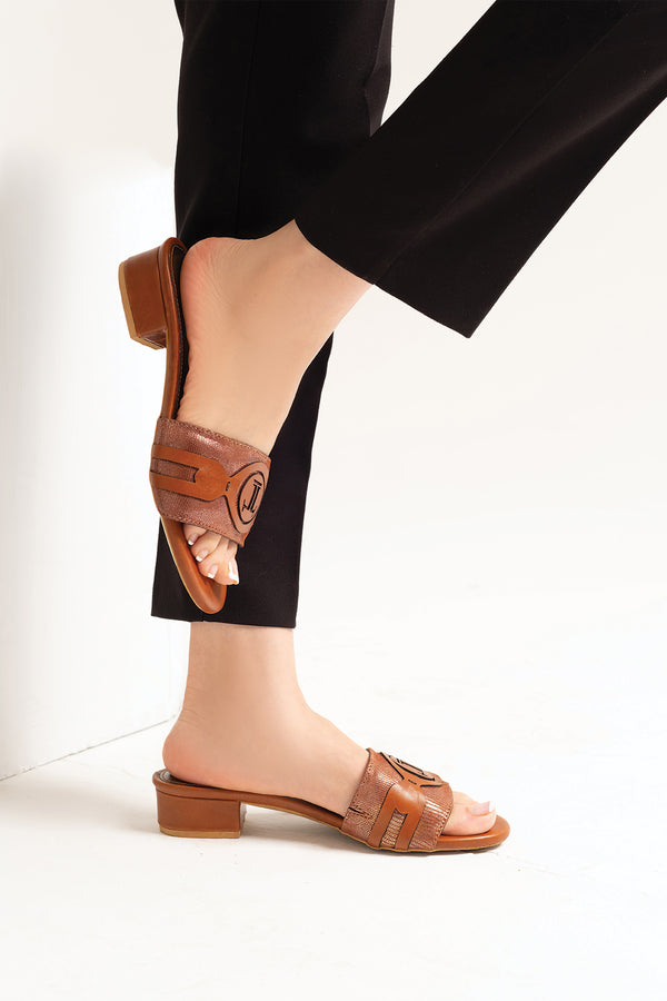 Women leather block heel slides in brown colour with laser cutting and shiny strap by JULKE