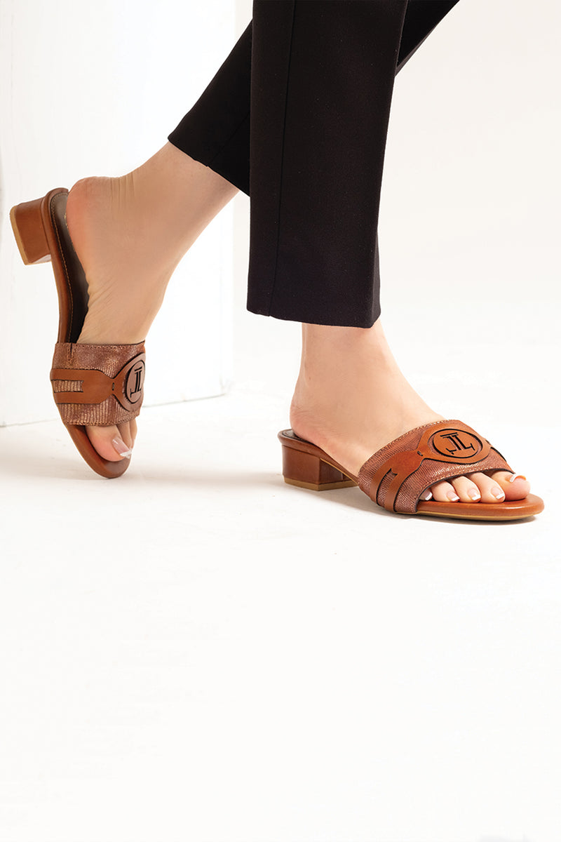 Women leather block heel slides in brown colour with laser cutting and shiny strap by JULKE
