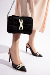 Womens leather shoulder bag in black colour with bows and pearl chain with matching heels by JULKE