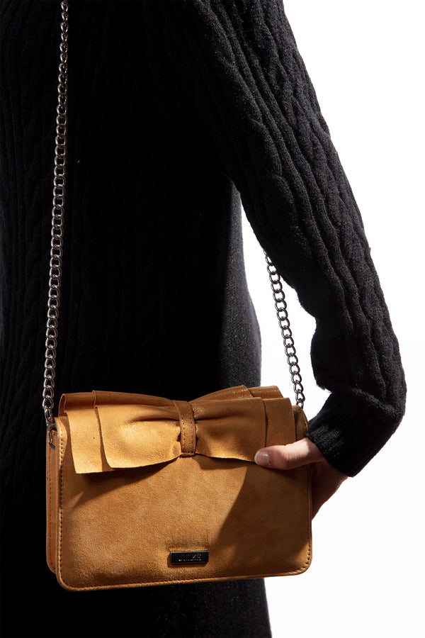 Womens leather shoulder bag in mustard colour with bows and pearl chain by JULKE