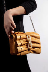 Womens leather shoulder bag in mustard colour with bows and pearl chain by JULKE