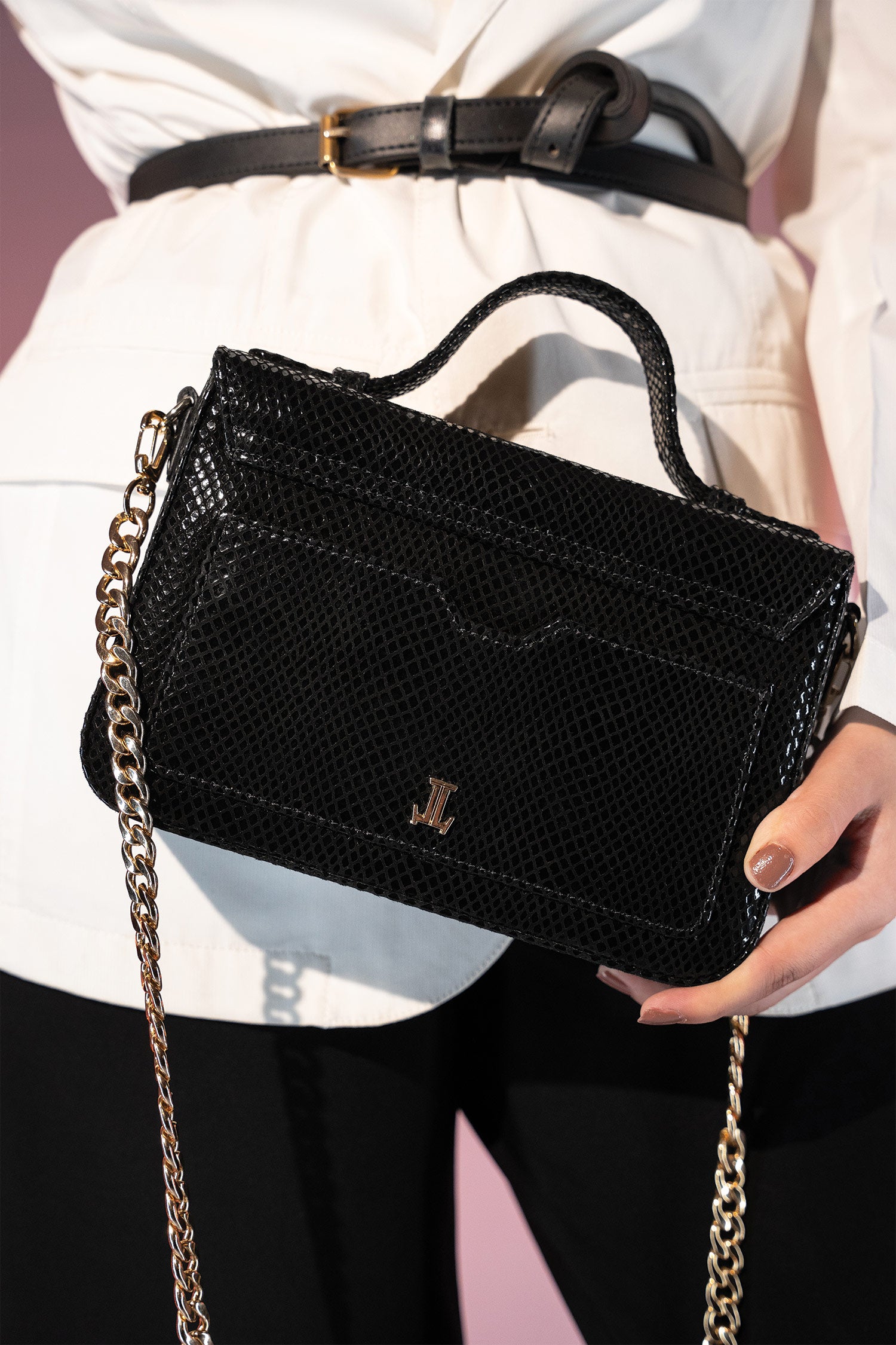 Women's leather top handle shoulder bag in black reptile texture with metal wood and metallic gold chain strap by JULKE