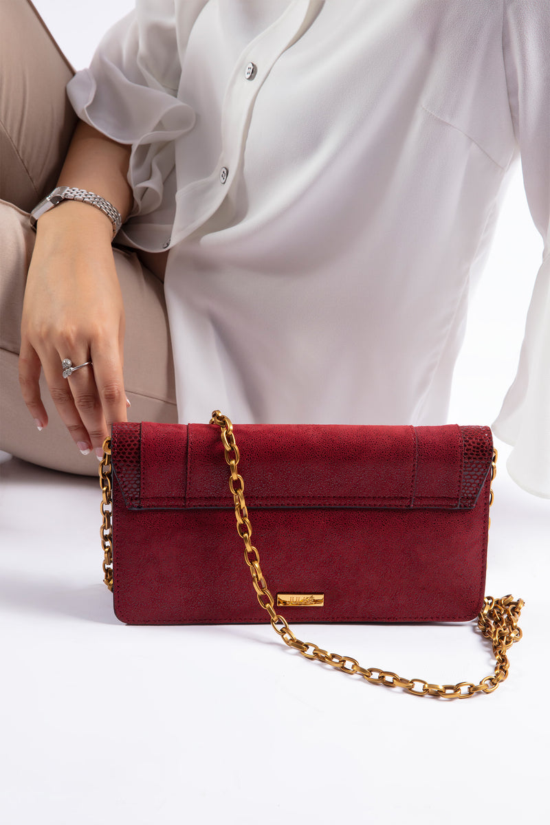Womens leather shoulder bag in dark red colour with gold chain by JULKE