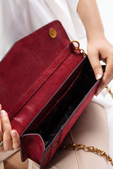 Womens leather shoulder bag in dark red colour with gold chain by JULKE