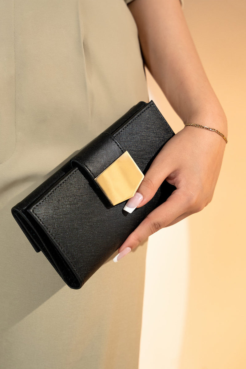 Women's leather long wallet in black colour in crosshatch texture with gold metal press button strap and extra pockets by JULKE. 