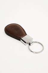 Leather key chain in dark brown colour in round shape and metal ring by JULKE