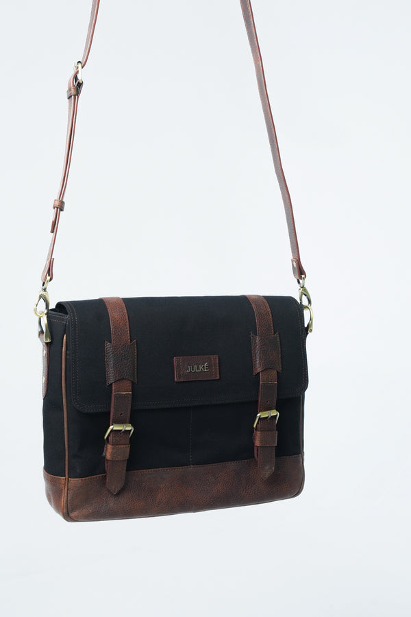Mens leather and canvas laptop messenger bag in black and rust colour with detachable shoulder strap by JULKE