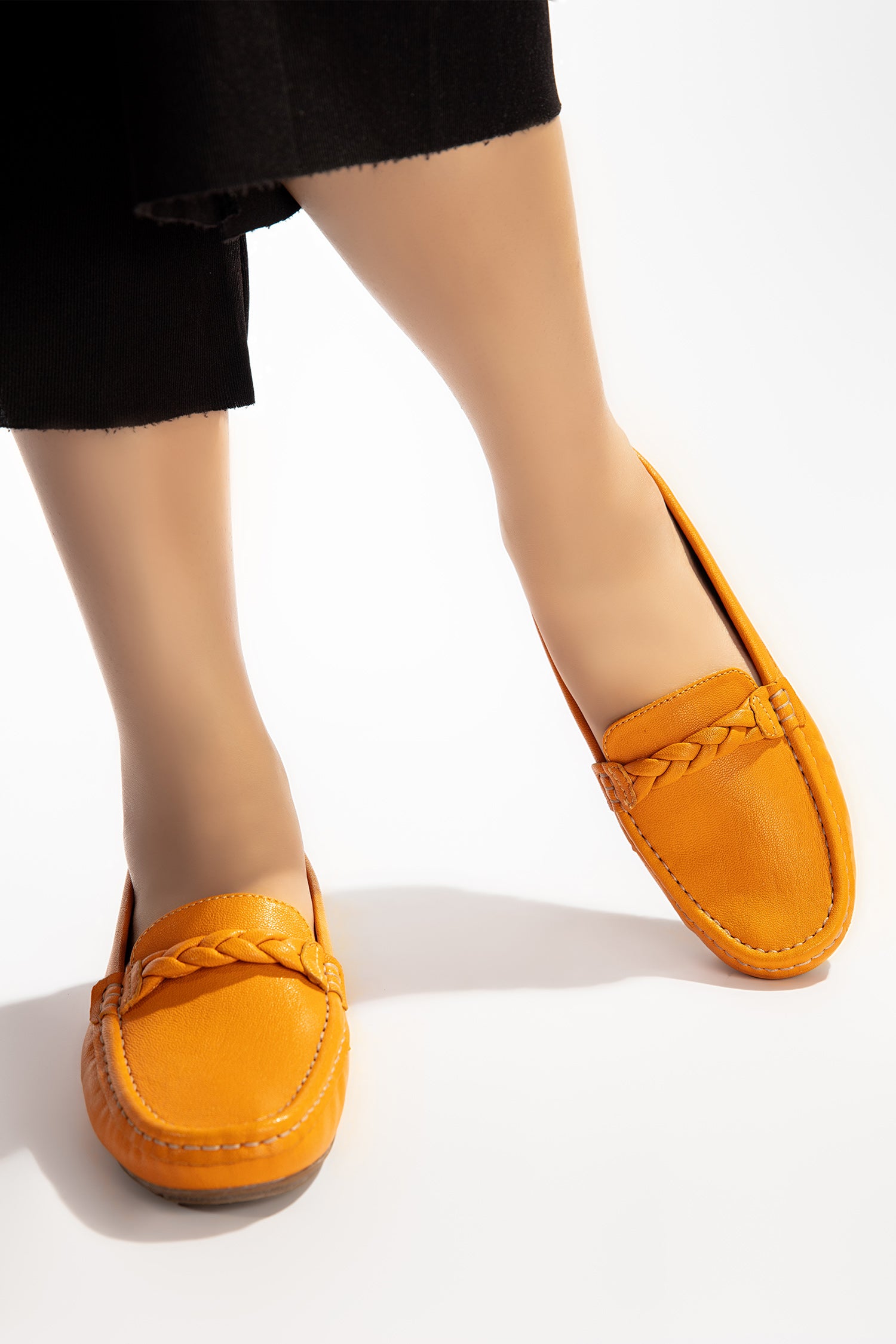 Womens winter moccasins in orange colour with braided straps by JULKE