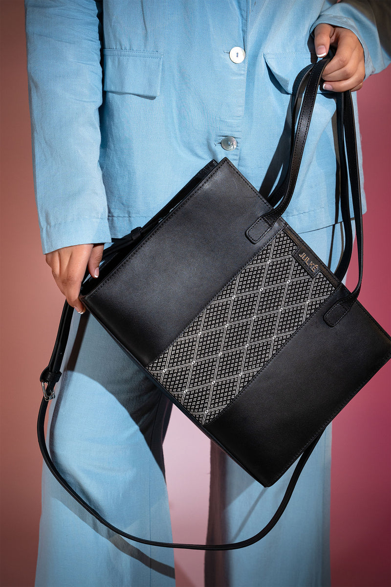 Women's leather tote bag medium size in black colour with diamond pattern fabric strip and detachable shoulder strap by JULKE. 